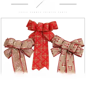 Set of three linen Christmas bows with red glitter edges and white festive patterns