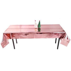 Metallic rose gold foil tablecloth for birthday parties with a shiny reflective surface