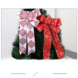 Close-up of festive burlap Christmas bows with gold snowflake and red vintage patterns