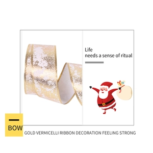 Detailed view of gold textured Christmas ribbon with reinforced edges for gift wrapping