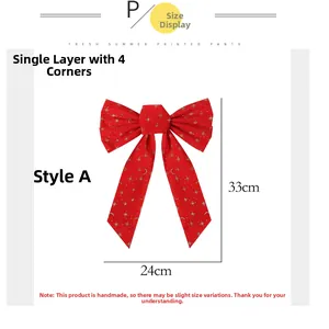 Detailed view of red Christmas bow with golden star and moon prints for holiday tree decor