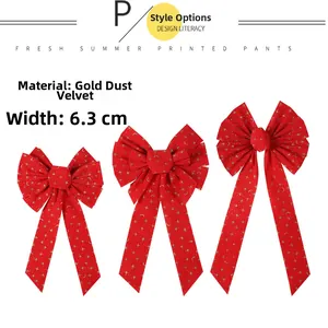 Detailed view of red velvet Christmas bows with gold stars and moon 6.3cm width