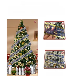 Blue Christmas ribbon with gold snowflake patterns showing LED lights on a decorated tree