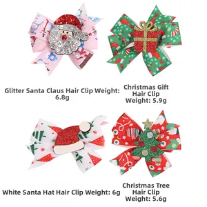 Lot de quatre barrettes de Noël avec motifs de Père Noël, sapin et cadeaux à paillettes
