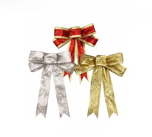 Close-up of 15cm Christmas bows in glittery red, gold, and silver for tree decoration
