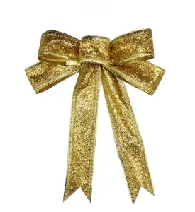 Detail of 15cm large gold glitter bow decoration with textured metallic finish