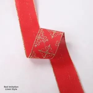 Close-up of red linen-texture ribbon with golden snowflake patterns for Christmas decor