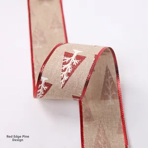 Close-up of 2m Christmas ribbon with red glitter edges and white pine tree patterns