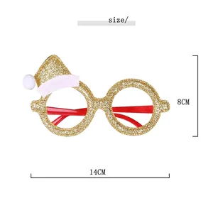 Sparkly gold Christmas elf glasses with red hat decoration, size 14cm by 8cm