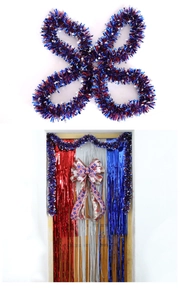 Detail of red blue and silver foil fringe curtains with star tinsel garland for Independence Day