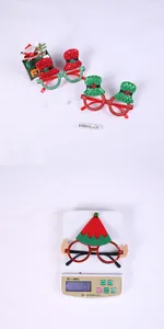 Close-up of lightweight glitter Christmas elf glasses and 15g weight scale display