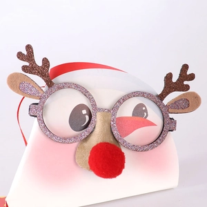 Detail view of festive reindeer glasses with glitter horns and a red pom-pom nose