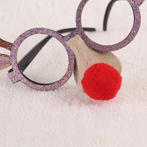 Close-up of glittery Christmas reindeer glasses with a red pom-pom nose and reindeer antlers