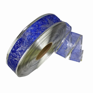 Royal blue transparent Christmas ribbon with silver glitter star patterns and metallic edges