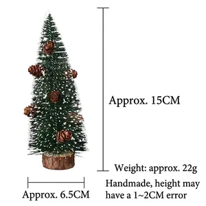Miniature 15cm Christmas tree with snow frosting and pine cones on wood base