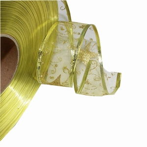 Detail of 3.8cm gold sheer Christmas ribbon with glitter stars and wired metallic edges