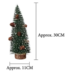 Detail view of 30cm frosted mini Christmas tree with pine cones and wooden base
