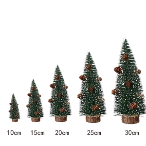 Set of five mini green frosted Christmas trees with pine cones and wooden bases