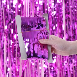 Metallic purple foil fringe curtain backdrop for birthday party decorations and events