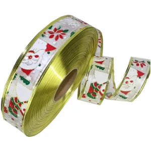 Macro view of 3.8cm Christmas ribbon with Santa Claus and festive snowflake patterns