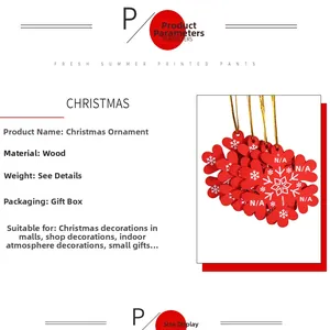 Detailed view of red and white wooden snowflake and heart ornaments with golden cords