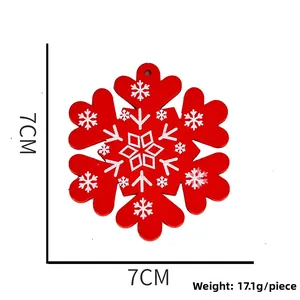 Detail view of 7cm red wooden snowflake ornament with white patterns for Christmas tree decor