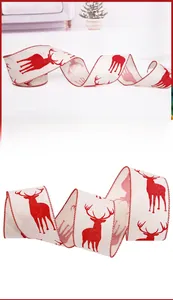 Detail of Christmas burlap ribbon with red reindeer patterns and red stitched edges