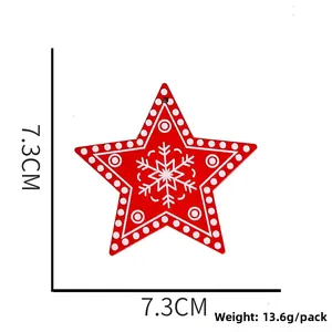 Red star Christmas ornament with white snowflake pattern measuring 7.3cm for tree decor