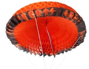 Detail of Halloween honeycomb paper fan decoration in classic orange and black festive colors