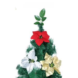 Close-up of artificial poinsettia flowers in red, white and gold for Christmas tree decor