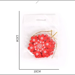 Red wooden snowflake ornaments set in packaging for Christmas tree decoration