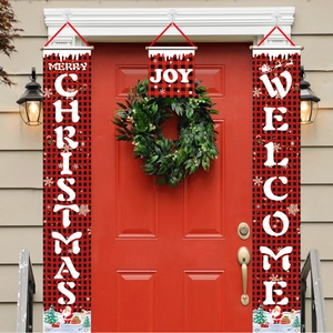 Detail of Christmas buffalo plaid banners with Santa motifs on a red festive front door