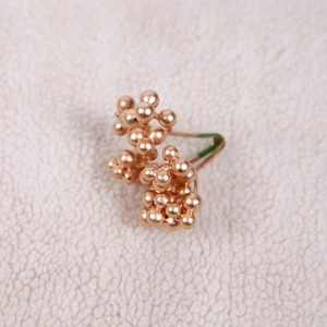 Rose gold berry cluster stud earrings on white fleece background for Christmas jewelry decor