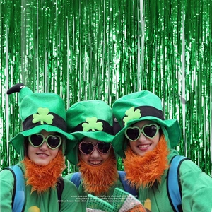 Green metallic tinsel foil fringe curtains used as background for party photo shoot