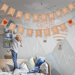 German Willkommen Zuhause welcome home banner with red hearts for festive party wall decor