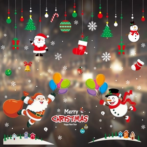 Detail view of festive window stickers featuring Santa Claus and snowman motifs