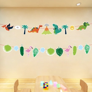 Detail of dinosaur and flamingo themed festive bunting banners for party decoration