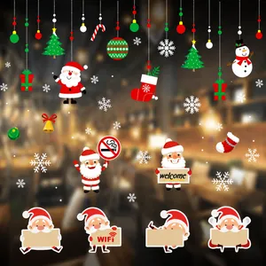 Macro detail of colorful Christmas window clings with Santa Claus and festive snowflake decals