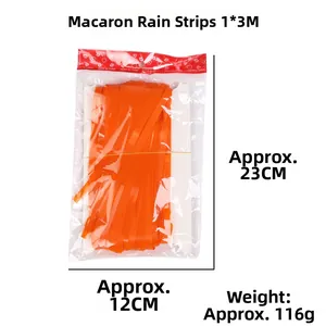 Macro detail of macaron orange tinsel foil fringe curtain in retail packaging 1x3m