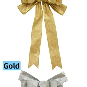 Detail view of decorative gold and silver Christmas bows with metallic glitter coating