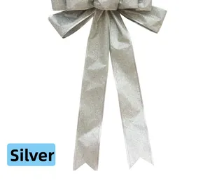 Close-up of sparkling silver glitter bow ornament for Christmas tree decoration
