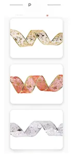 Detail of Christmas ribbons with metallic edges, gold stars, and festive snowflake patterns