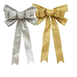 Pair of large gold and silver glitter Christmas bows for festive tree decoration and party ornaments