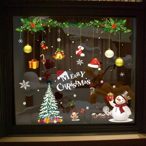 Christmas window stickers set featuring snowman, reindeer and tree on glass pane