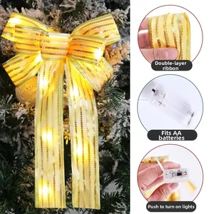 Detail of LED Christmas bow decoration with double-layer gold ribbon and battery box