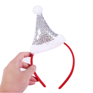 Detail showing red velvet headband with silver sequin Christmas hat and plush trim