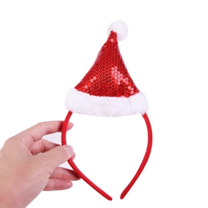 Detail of red sequin Christmas hat headband with soft white faux fur trim for parties