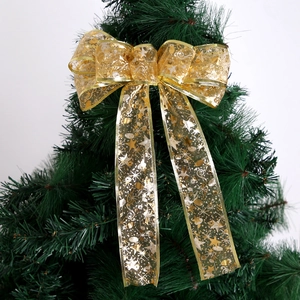 Golden Christmas tree topper ribbon bow with shimmering music notes and stars design
