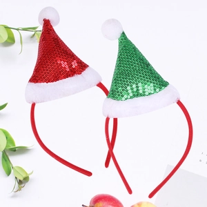Detailed view of festive mini sequin Christmas hat headbands in red and green colors