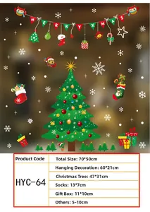 Detail view of Merry Christmas window stickers including trees, owls, and snowflakes decoration